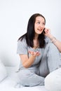 Woman on bed having conversation by phone Royalty Free Stock Photo