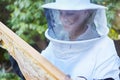 Woman, beekeeper hat or wooden frame check on honey farming land, sustainability agriculture or healthy food farm. Smile