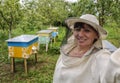 Woman beekeeper making selfie
