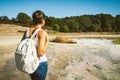 Young woman trekking to the Solfatara di Manziana sulphurous area in Italy.