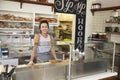 Woman behind the counter of sandwich bar looking to camera Royalty Free Stock Photo