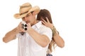 Woman behind cowboy with gun aming close Royalty Free Stock Photo