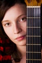 Woman behind fretboard Royalty Free Stock Photo