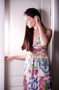 Woman behind opened white door Royalty Free Stock Photo