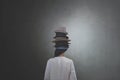 woman from behind wears countless hats on her head concept of multiple personalities and identities Royalty Free Stock Photo