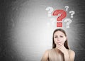 Woman in beige and question marks, blackboard Royalty Free Stock Photo