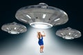 Woman being abducted by UFO - alien abduction concept Royalty Free Stock Photo