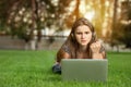 Woman being angry and holding fist in air looking at computer Royalty Free Stock Photo