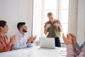 Woman being applauded at work after a presentation Royalty Free Stock Photo