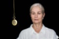 Woman being hypnotized with pendulum Royalty Free Stock Photo