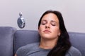 Woman Being Hypnotized While Sitting On Sofa