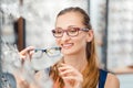 Woman being satisfied with the new eyeglasses she bought in the store Royalty Free Stock Photo