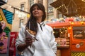 woman with Belgian french fries with sauce at street food festival. food truck Royalty Free Stock Photo