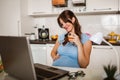 Woman with belly working as freelancer with laptop