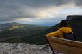 Woman bench mountain. a thoughtful woman traveler