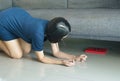 Woman bent and searching something under sofa bed lost thing Royalty Free Stock Photo