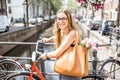 Woman with bicycle in Amsterdam city
