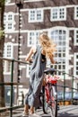 Woman with bicycle in Amsterdam city Royalty Free Stock Photo