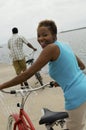 Woman With Bicycle At Beach