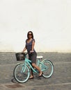 Woman With A Bicycle In A City