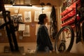 Woman bicycle mechanic standing against wall in garage Royalty Free Stock Photo