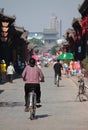 Woman on bicycle in old town of Pingyao Royalty Free Stock Photo