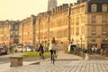 woman on bicycle at Place de la Bourse in Bordeaux city