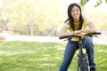 Woman on bicycle smiling