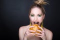 Woman with big hamburger