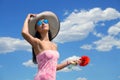 Woman in a big stripy hat with the poppy flowers Royalty Free Stock Photo
