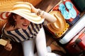 Woman with big summer hat eating ice cream packing for holiday Royalty Free Stock Photo