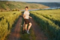 Woman with bike enjoy summer vacation in the beautiful meadow