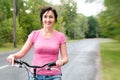 Woman with bike on the rainy Royalty Free Stock Photo