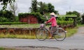 A woman with bike on rural road in Sadek, southern Vietnam