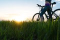 Woman bike sunset. exercise at sunset Royalty Free Stock Photo