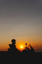 Woman biker silhouette over sunset, female riding motorcycle, motorbike driver traveling, lady look on the beach, freedom Royalty Free Stock Photo