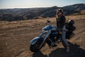 Woman biker sitting on her motorcycle