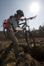 Woman biker in swampland Royalty Free Stock Photo