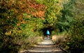 Woman Biking on New England Rail Trail in Autumn