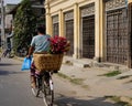 A woman biking on street in Bagan, Myanmar Royalty Free Stock Photo