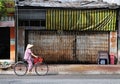 A woman biking on street in Chaudok, Vietnam Royalty Free Stock Photo