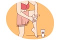 Woman apply sunscreen on legs