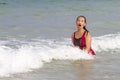 Woman with bikini crimson relax wave on beach Royalty Free Stock Photo