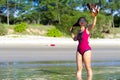 Woman with bikini crimson show hat on beach Ban Krut