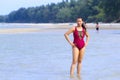 Woman and bikini dark red sex symbol on beach