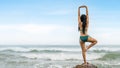 Woman in bikini have standing meditation and yoga in sea in summer Royalty Free Stock Photo