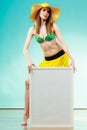 Woman In Bikini Holds Blank Presentation Board.