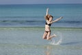 Woman with bikini jumping in the sea hochformat Royalty Free Stock Photo