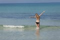 Woman with bikini jumping in the sea hochformat Royalty Free Stock Photo