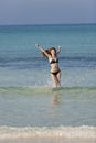 Woman with bikini jumping in the sea hochformat Royalty Free Stock Photo